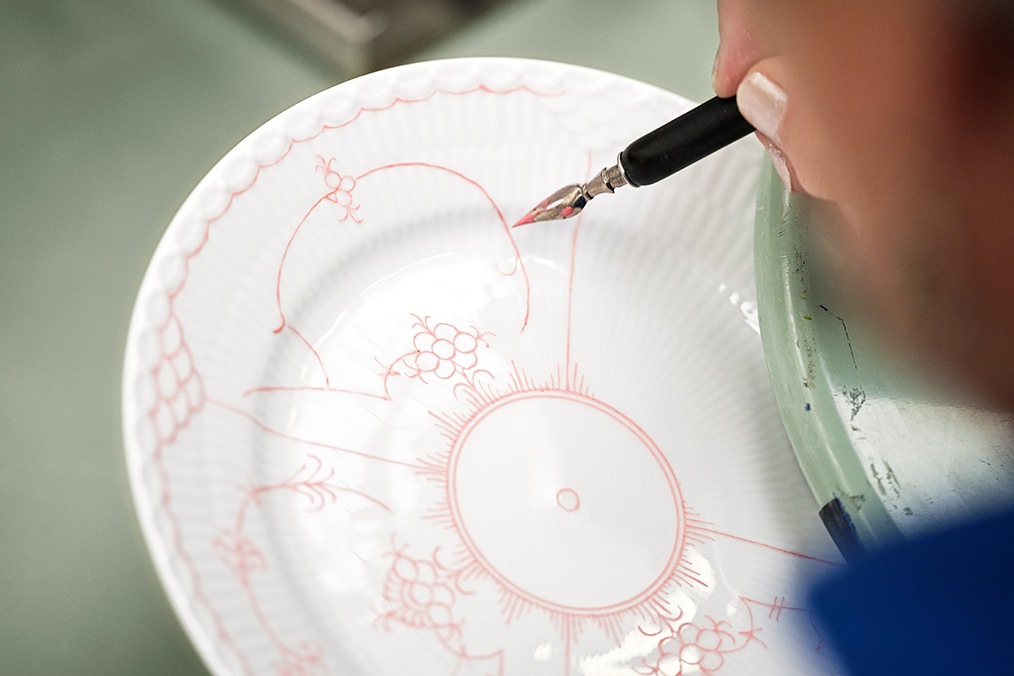 Hand painting a Coral Fluted Half Lace plate